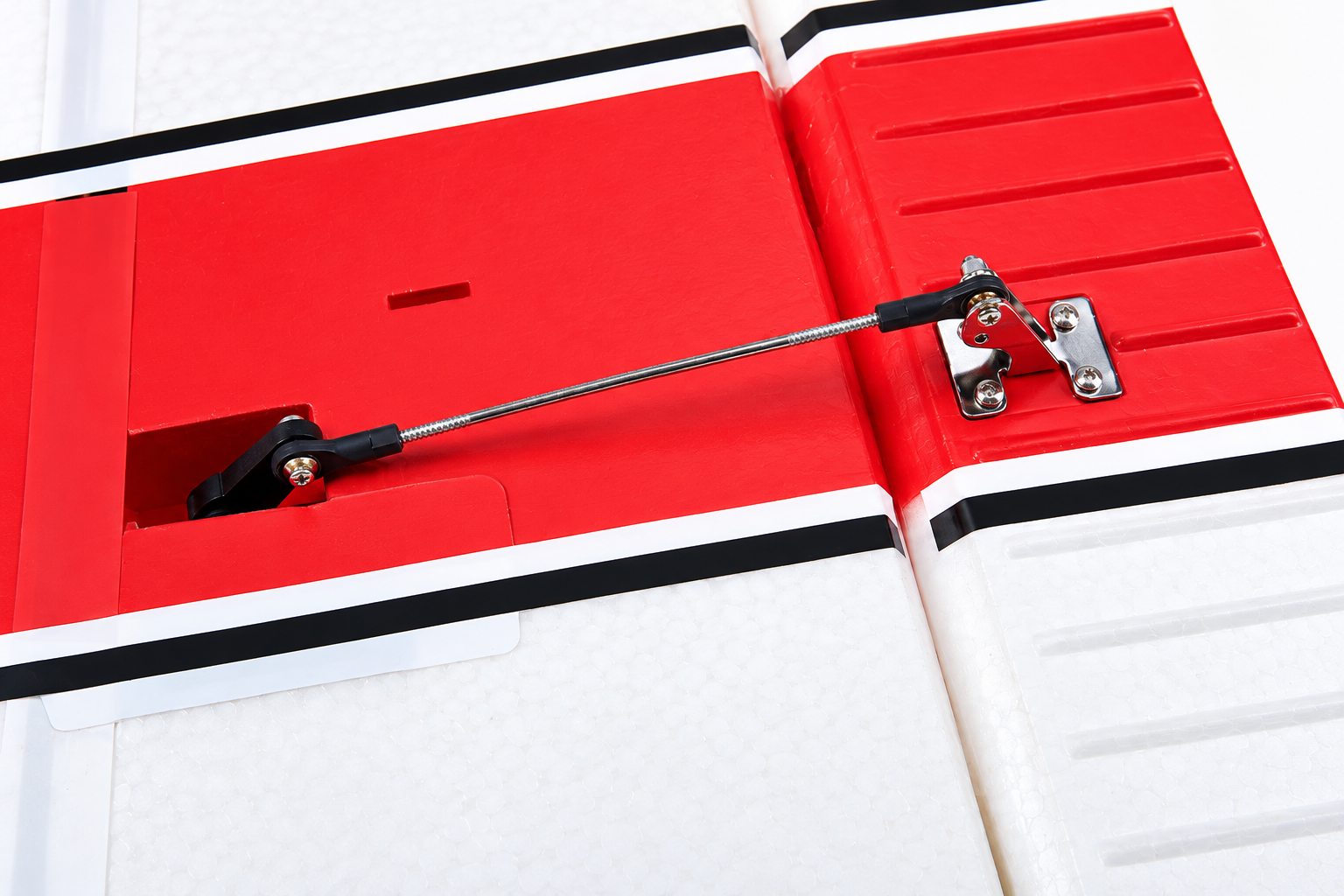 Close-up of the Cessna 182 flap servo, control linkage, and flap surface